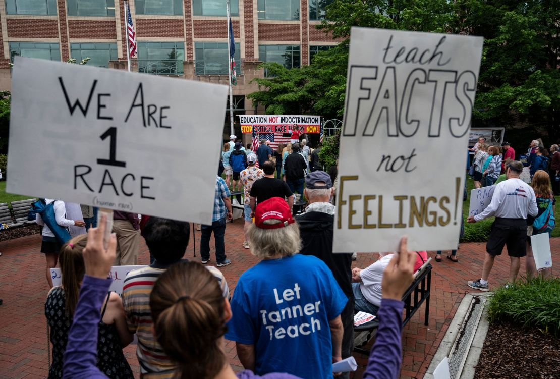 People attend a rally against critical race theory being taught in schools at the Loudoun County Government Center in Leesburg, Virginia on Saturday, June 12.