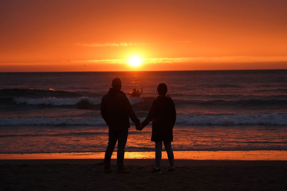 Taking full advantage of the summer solstice, a couple holds hands while watching the sun rise in Tynemouth, a coastal city in northeastern England. Click through the gallery to see more photos of how the longest day of the year sparks romance: