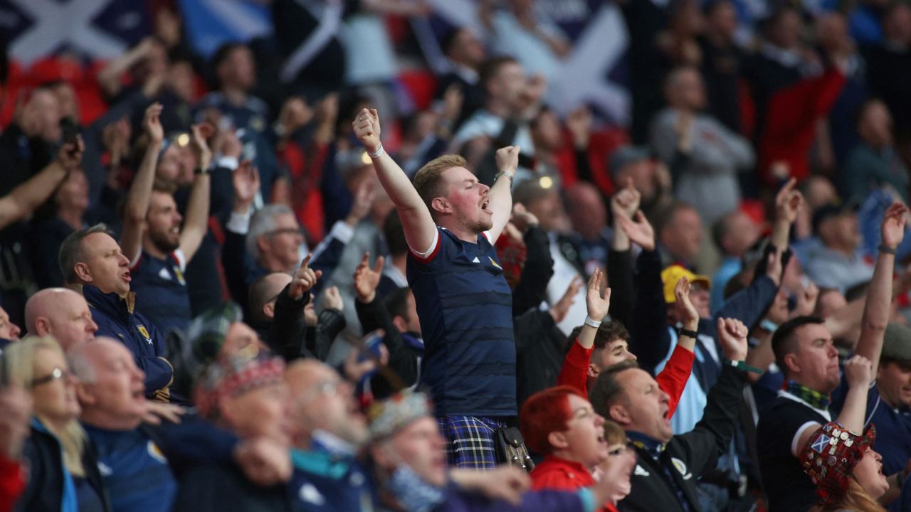 Scotland's supporters sing the national anthem before the start of the match against England.