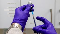 A health worker prepares a dose of the Pfizer-BioNtech Covid-19 vaccine at Clalit Health Services in Jerusalem, on March 2, 2021.