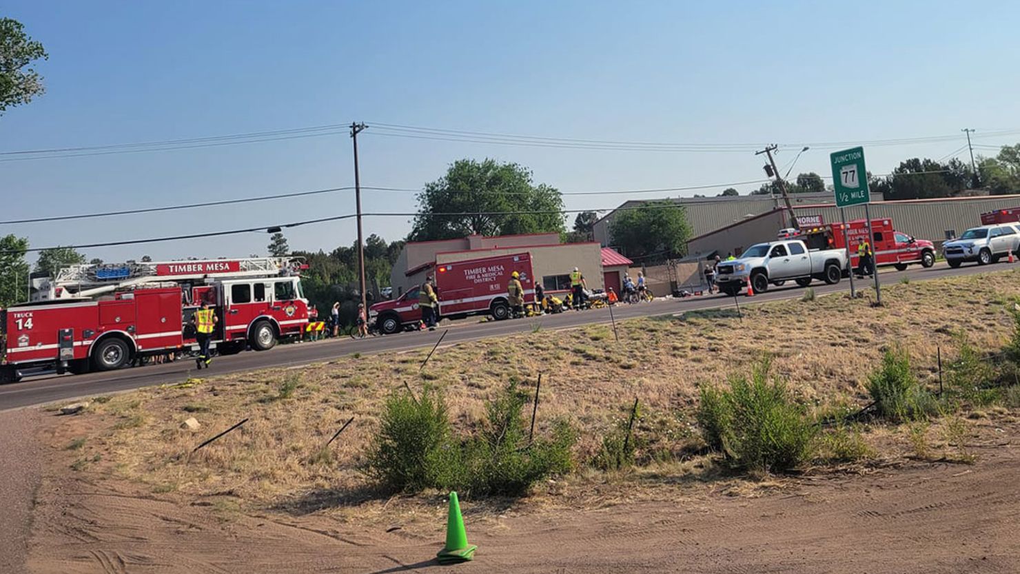 First responders attend the scene of an incident in Show Low, Arizona, where police say a suspect in a vehicle struck at least 9 cyclists on Saturday.