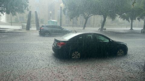 Heavy rain falls in downtown Pensacola, Florida, on Saturday.