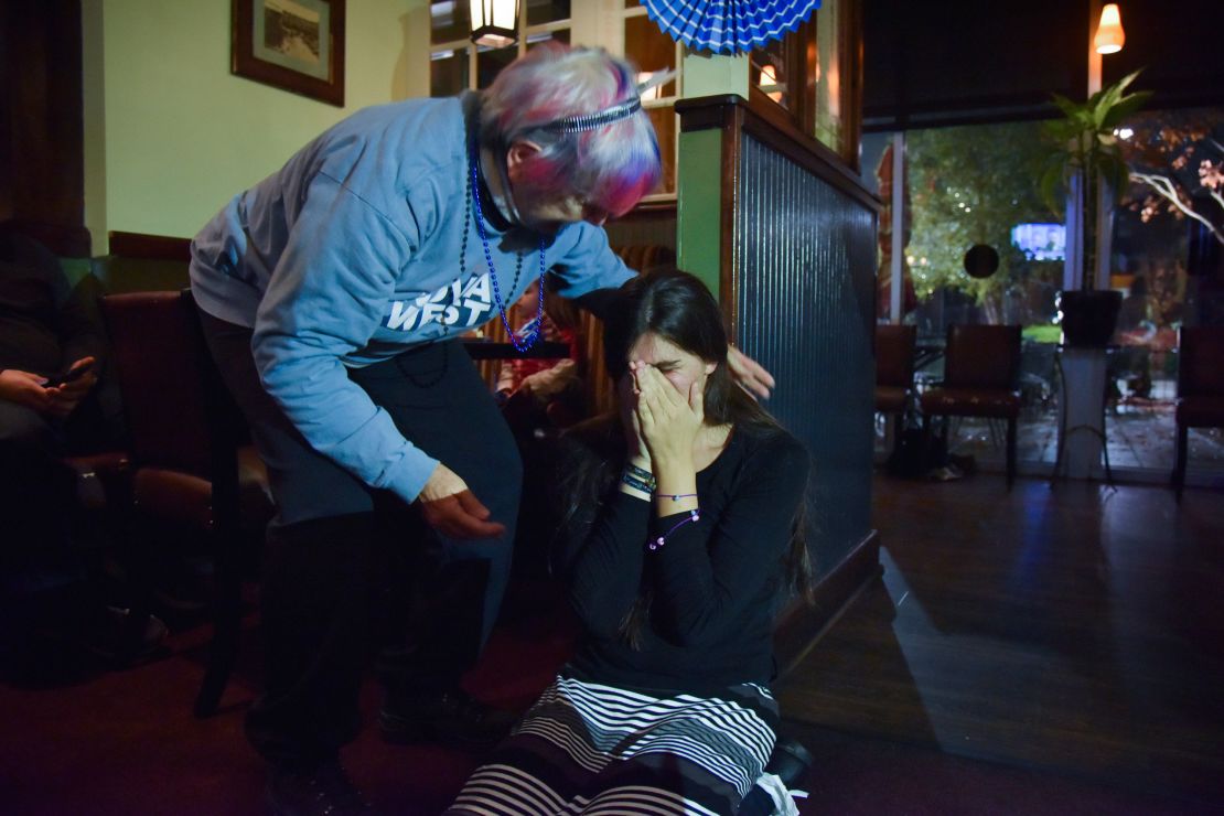 Roem falls to her knees after getting a call from Joe Biden congratulating her for her 2017 victory at an election watch party in Gainesville, Virginia. 