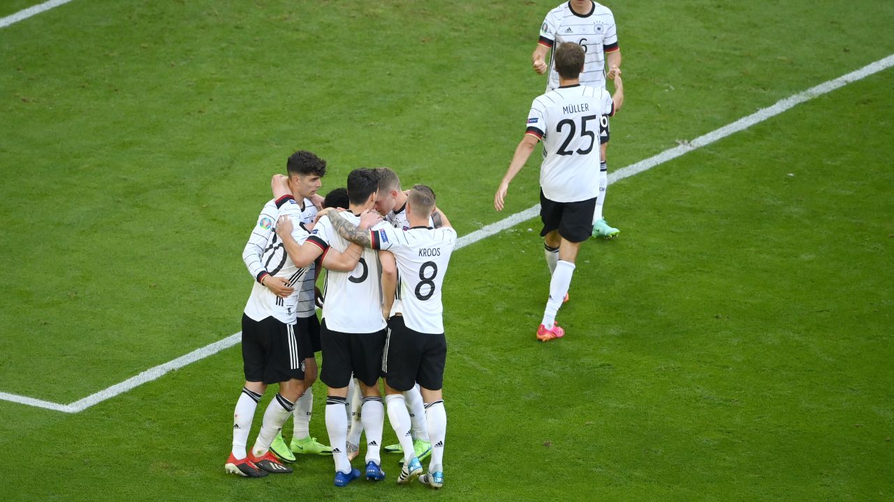 German players celebrate scoring against Portugal. 