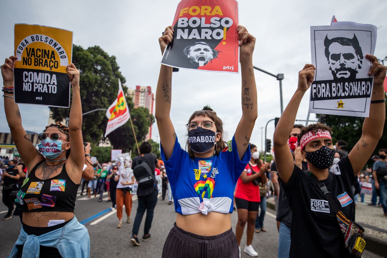 A demonstrator holds a sign that reads "Bolsonaro out" in a protest against Brazilian President Jair Bolsonaro's administration on June 19, 2021 in Rio de Janeiro. Many are angry at his handling of the Covid-19 crisis as the country marks 500,000 deaths from the virus.