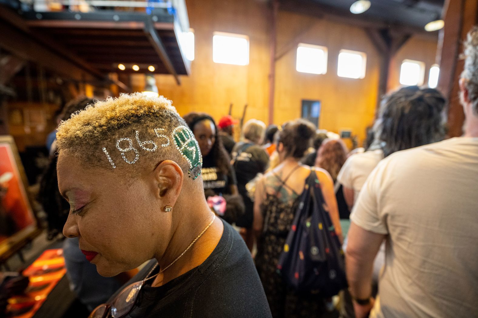 A woman displays rhinestones in her hair during the Juneteenth commencement at ROOTS 101: African American Museum in Louisville. 