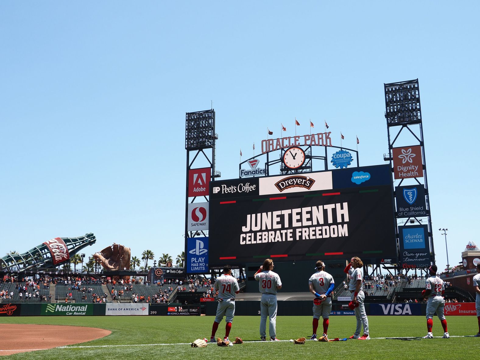 The scoreboard displays signage for Juneteenth before a game between the Philadelphia Phillies and San Francisco Giants at Oracle Park in San Francisco.