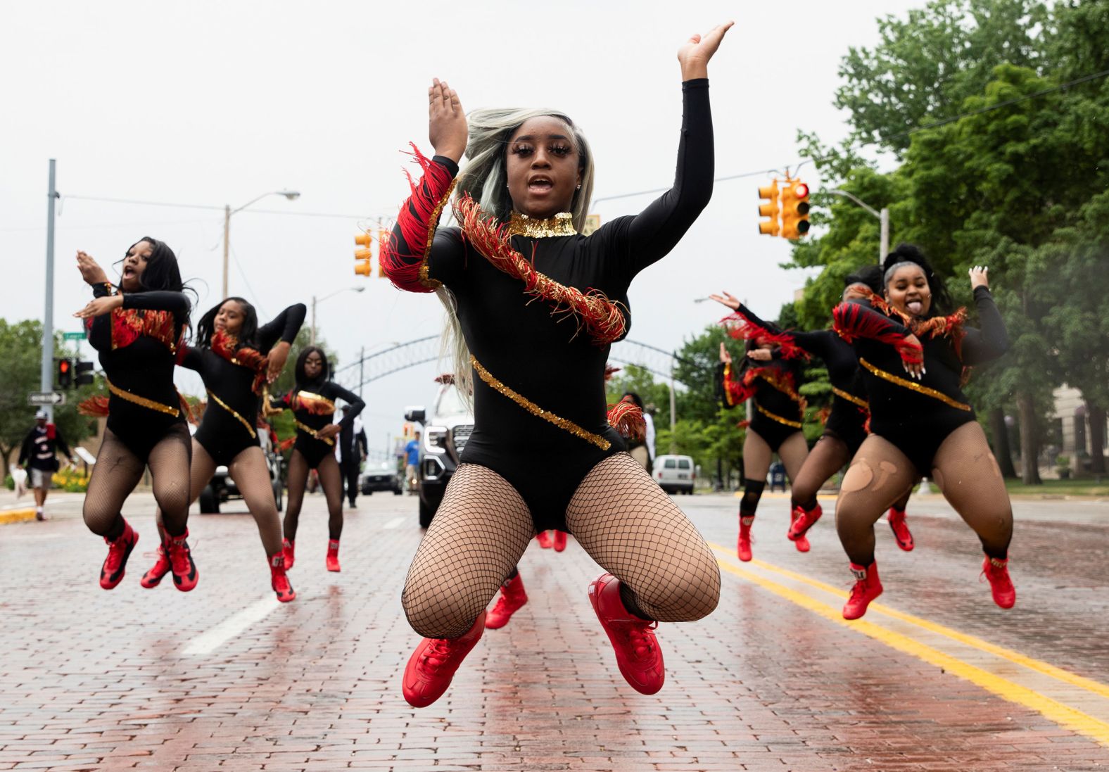 Dance captain Shair'Mae Harris leads members from the For The Love of Dance Studio during a parade to celebrate Juneteenth in Flint.