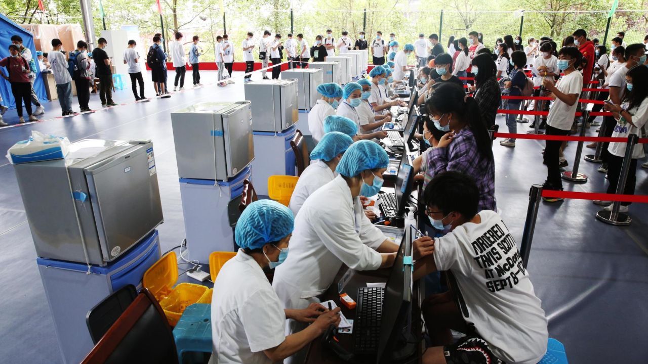 Doctors give COVID-19 vaccine to high school seniors at a temporary vaccination site in Chongqing, China on June 10.