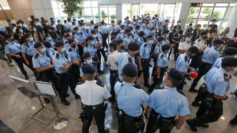 Police officers raid  the Apple Daily office on June 17 in Hong Kong.