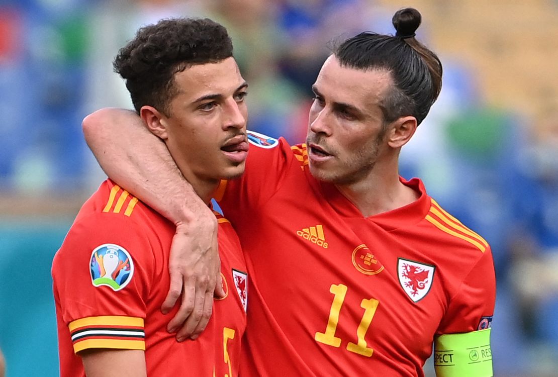 Gareth Bale, right, consoles Ethan Ampadu after his teammate's red card. 