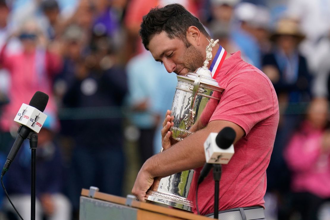 Rahm holds the champions trophy after the final round of the US Open.