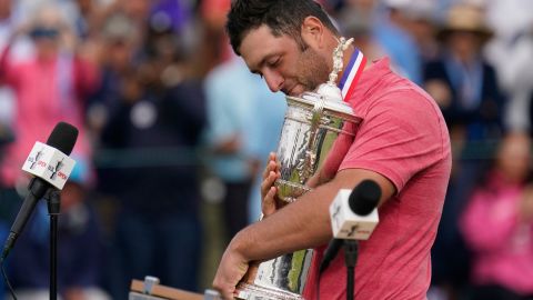 Rahm holds the champions trophy after the final round of the US Open.
