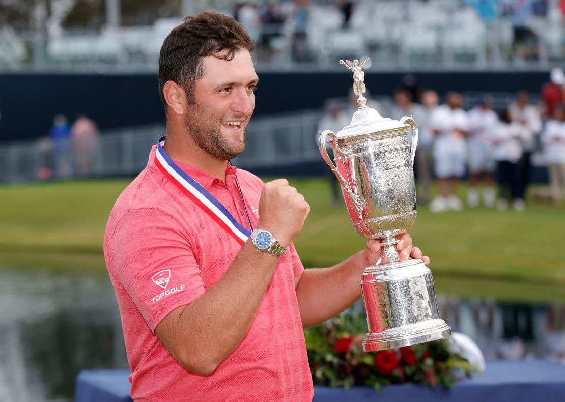 Rahm celebrates with the trophy after winning the US Open.