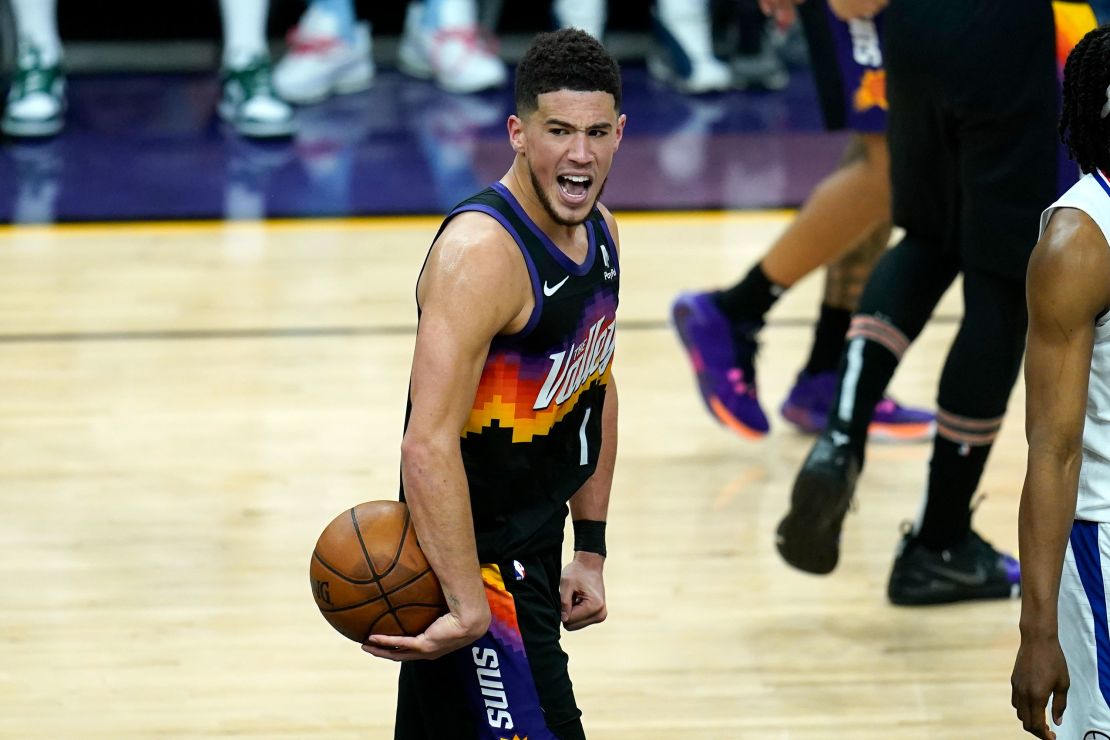 Booker celebrates in the closing seconds of the second half of Game One against the Clippers.