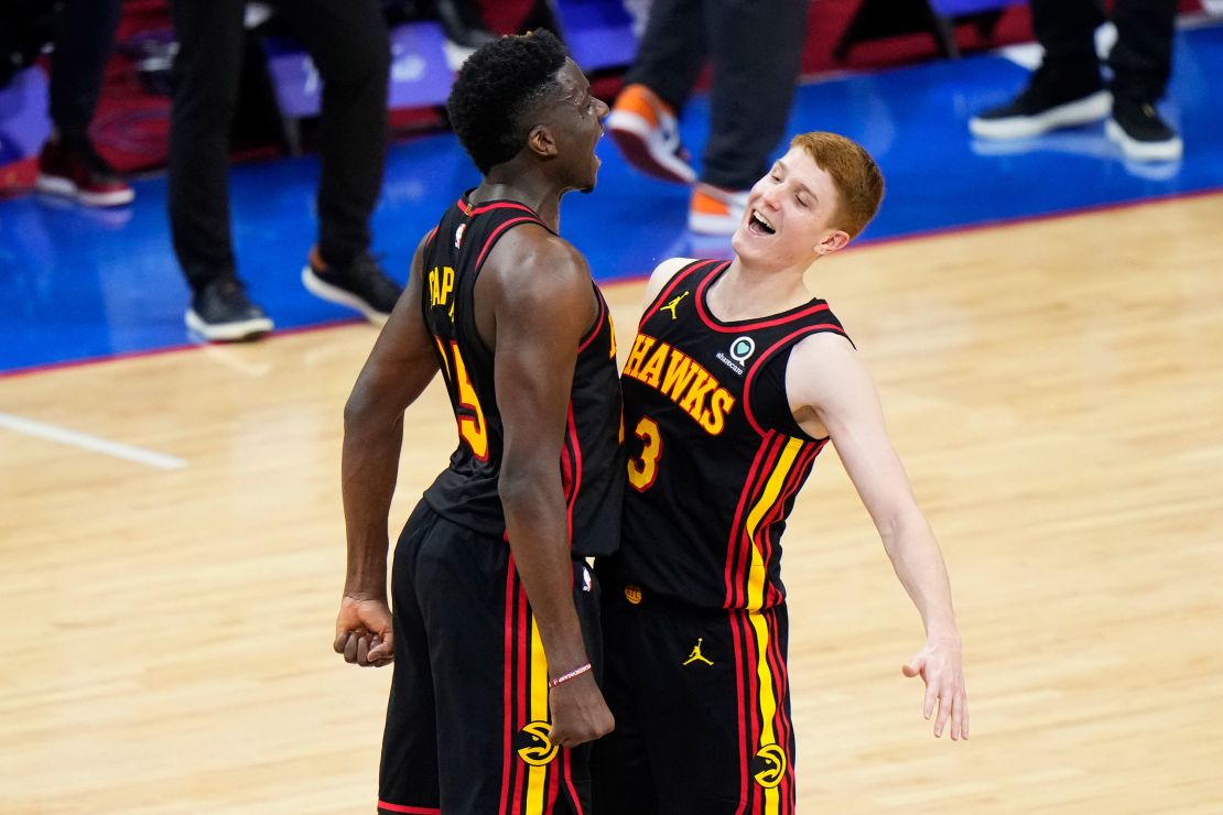 Huerter (R) and Clint Capela celebrate during the final seconds of Game Seven against the 76ers.