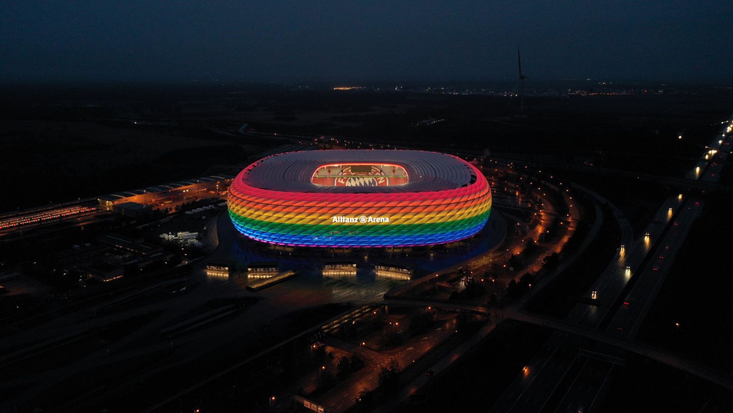 Munich's Allianz Arena is illuminated in rainbow colors during the Bundesliga match between Bayern Munich and Hoffenheim on January 30, 2021.