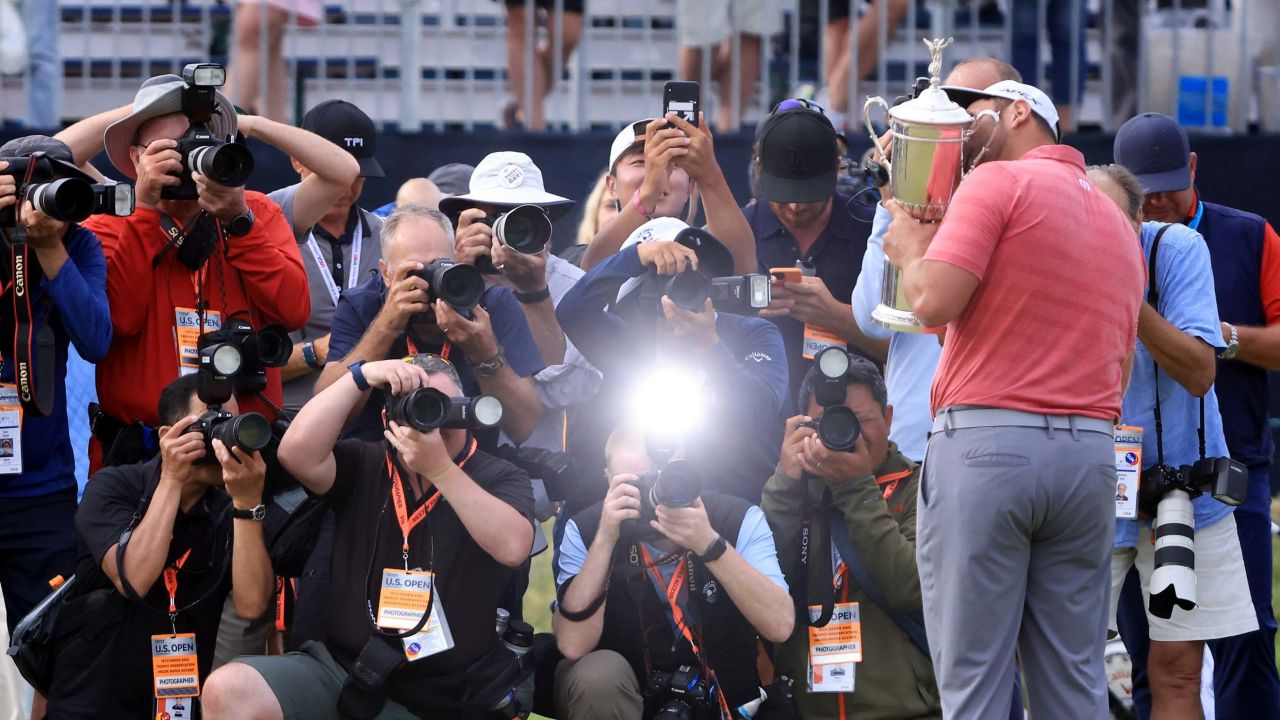 Rahm celebrates with the trophy after winning the 2021 US Open.