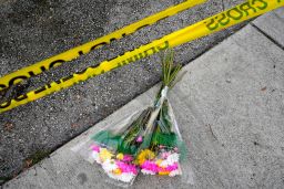 Flowers lie at the scene of the incident.