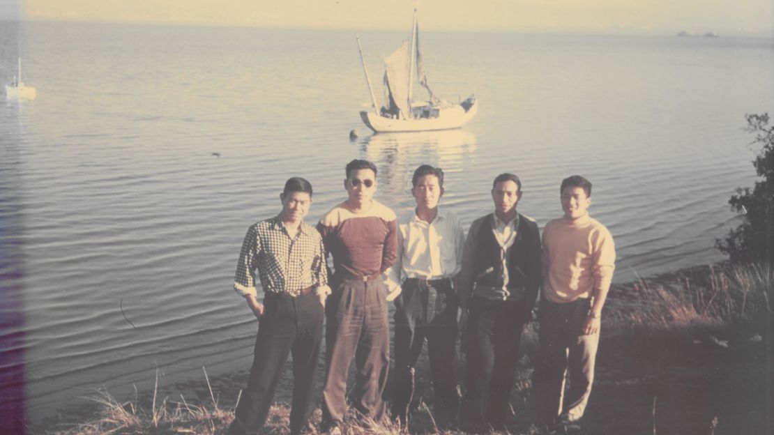 The five Chinese members of the crew pose in front of their boat after arriving in the US. 