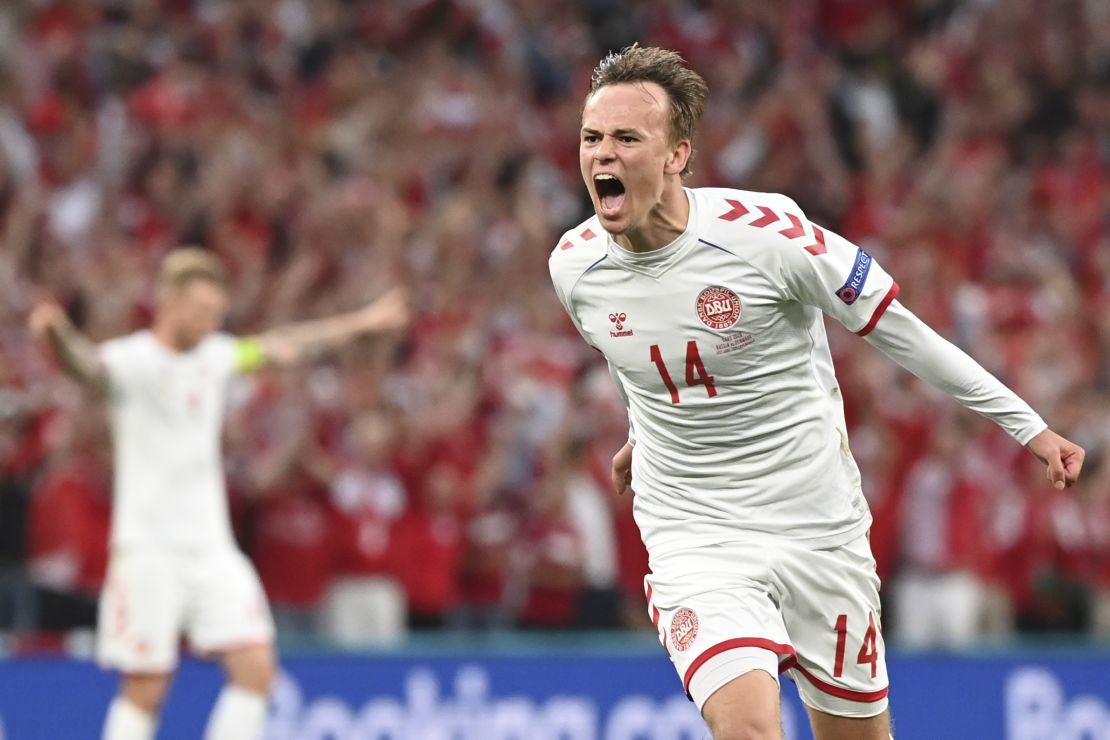 Denmark's Mikkel Damsgaard celebrates after scoring his side's opening goal against Russia.