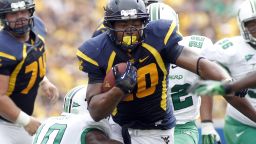 PITTSBURGH, PA - SEPTEMBER 01:  Shawne Alston #20 of the West Virginia Mountaineers carries the ball against the Marshall Thundering Herd during the game on September 1, 2012 at Mountaineer Field in Morgantown, West Virginia.  (Photo by Justin K. Aller/Getty Images)