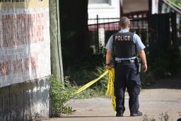 Police secure the scene of a shooting on June 15, 2021, in the Englewood neighborhood of Chicago. Five people were killed at a home during an early-morning shooting and several others were hospitalized.