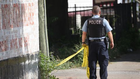 Police secure the scene of a shooting on June 15, 2021, in the Englewood neighborhood of Chicago. Five people were killed at a home during an early-morning shooting and several others were hospitalized.