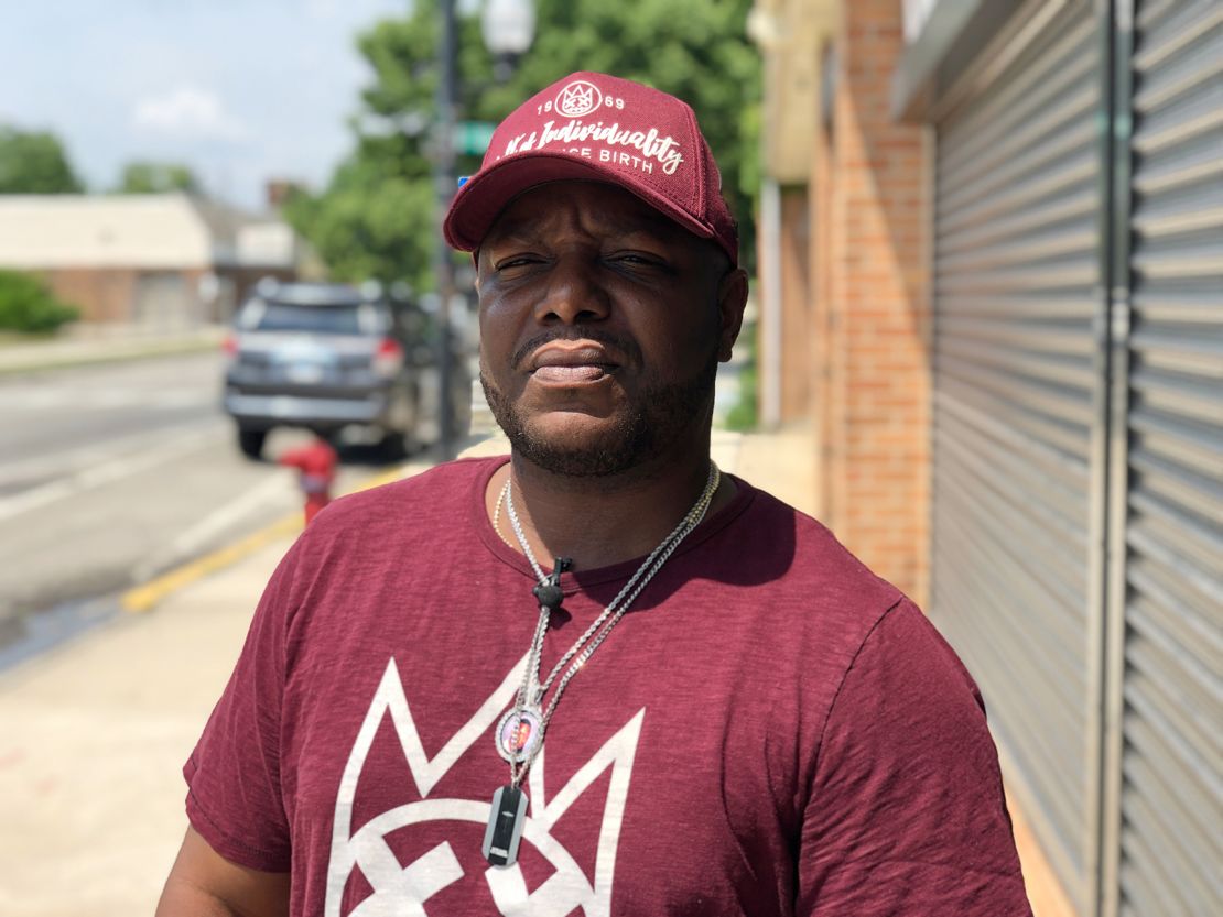 Jervon Hicks stands outside CRED's office in his South Side Chicago neighborhood of Roseland.