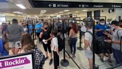 American Airlines customers seen stranded at Charlotte Airport after American Airlines cut 1 percent of its flights to alleviate pressure on operations due to labor shortage and increased travel on June 20, 2021 in Charlotte, North Carolina.