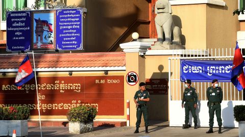 Police officers stand guard in front of the Phnom Penh Municipal Court in Phnom Penh, Cambodia on January 14, 2021.