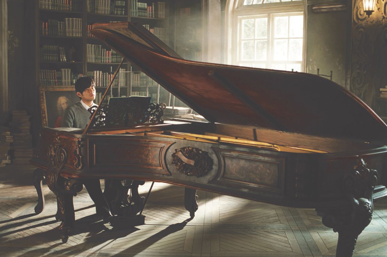 Jay Chou with an antique piano on the set of his directorial debut, "Secret." The instrument was displayed at Hong Kong's K11 Musea mall ahead of the Jay Chou x Sotheby's auction series.