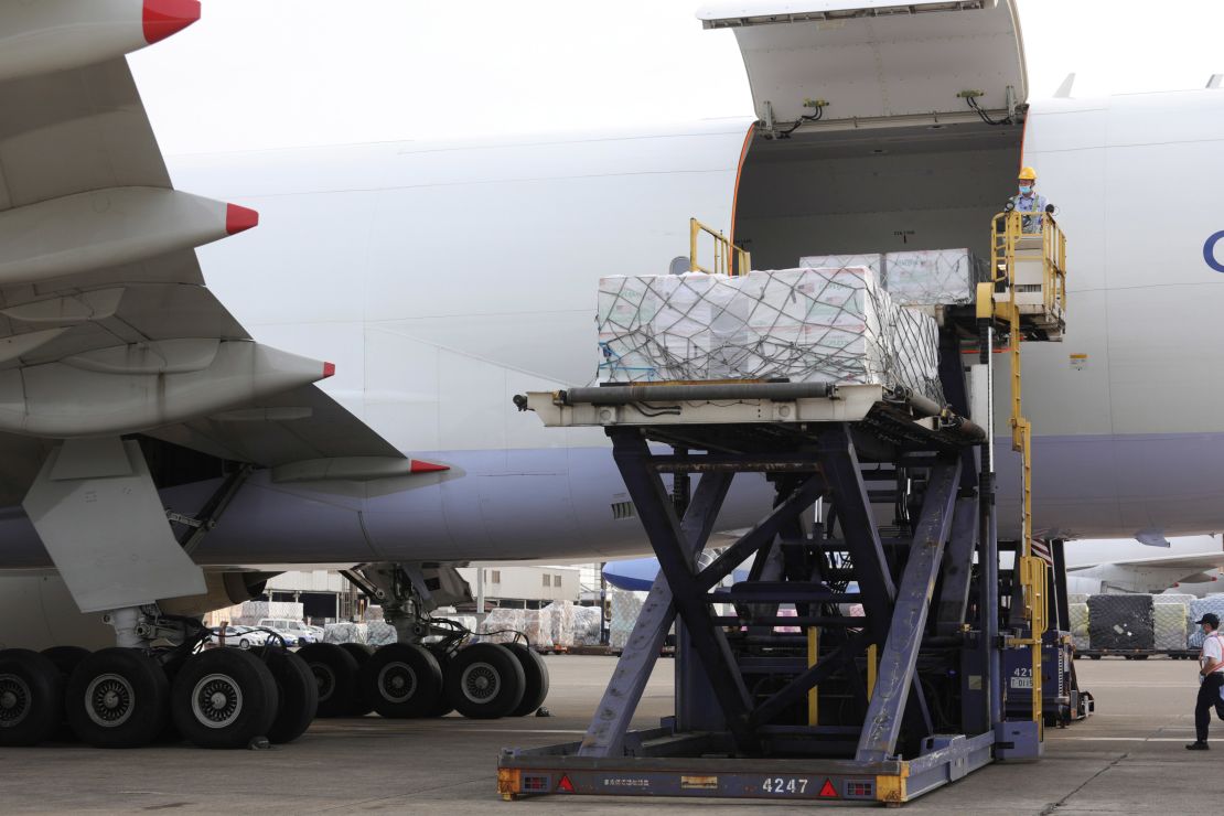 Workers unload Covid-19 vaccines from a cargo plane from Memphis in Taipei, Taiwan, on June 20.