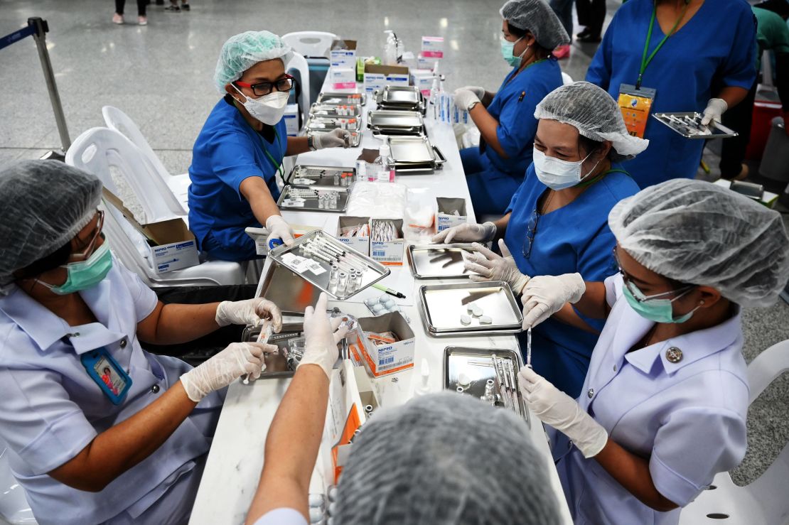 Health workers prepare doses of the CoronaVac vaccine in Bangkok on June 22.