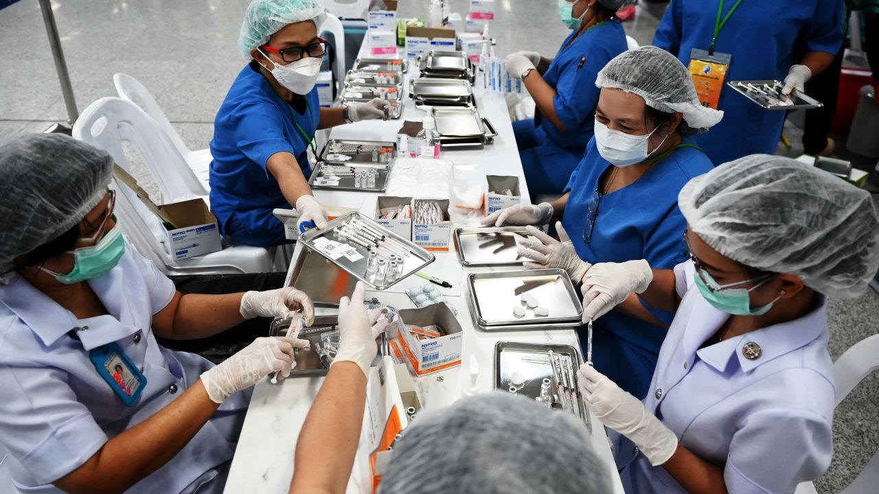 Health workers prepare doses of the CoronaVac vaccine in Bangkok on June 22.