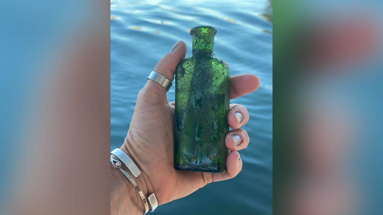 The bottle still had part of its cork inside and was about two-thirds full of water.