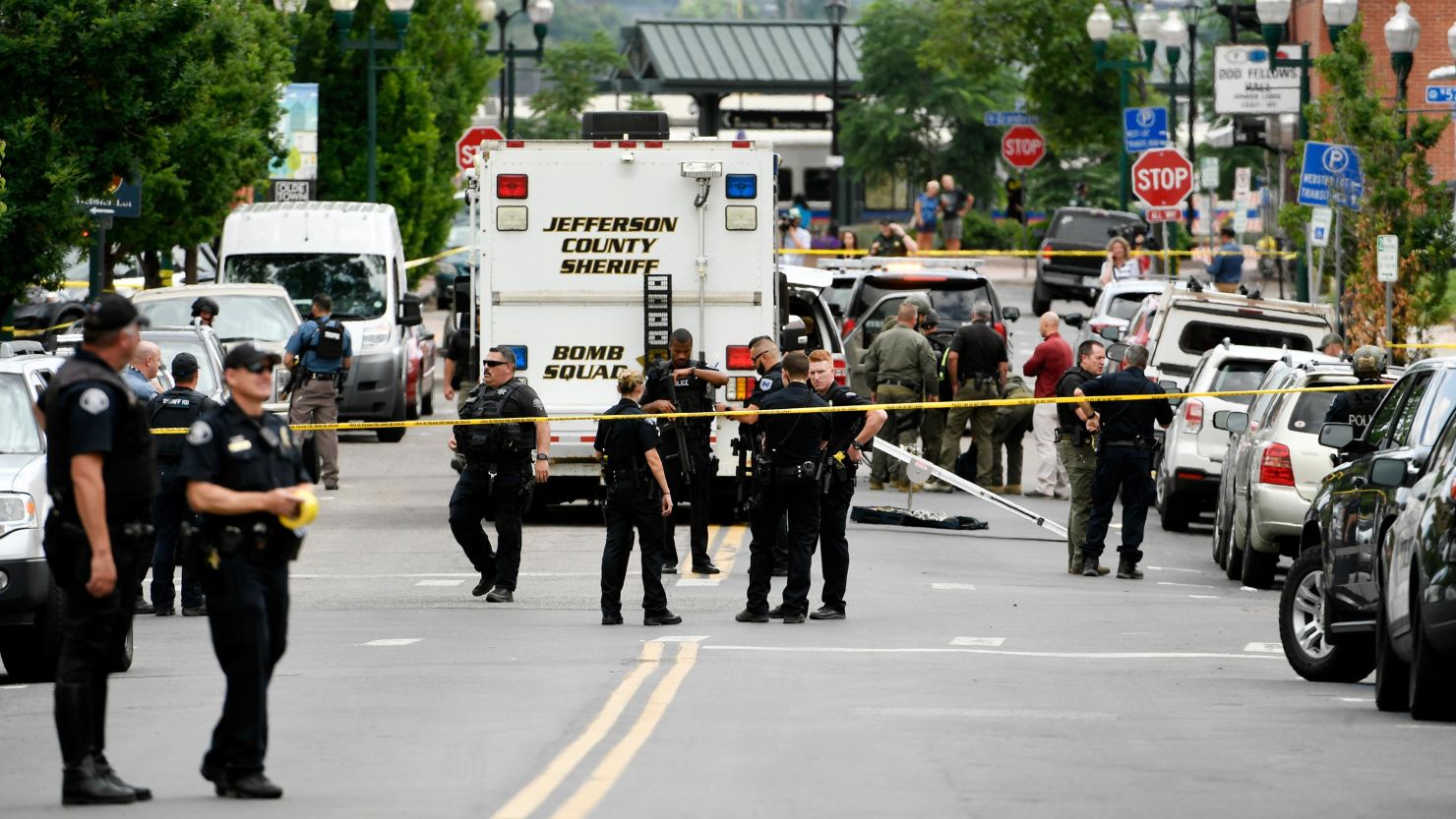 Police officers investigate the scene of a shooting in Arvada, Colorado, on Monday.  