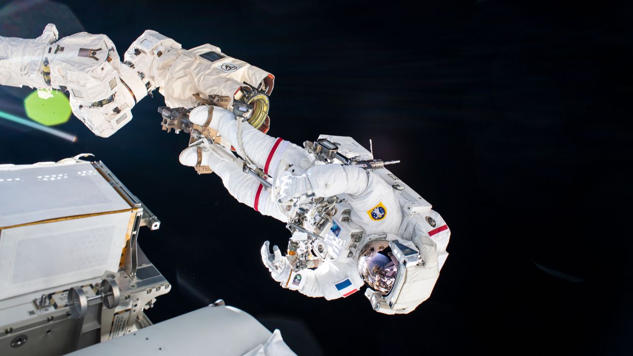 Pesquet is pictured attached to an articulating portable foot restraint on the end of the Canadarm2 robotic arm during a spacewalk on June 16.