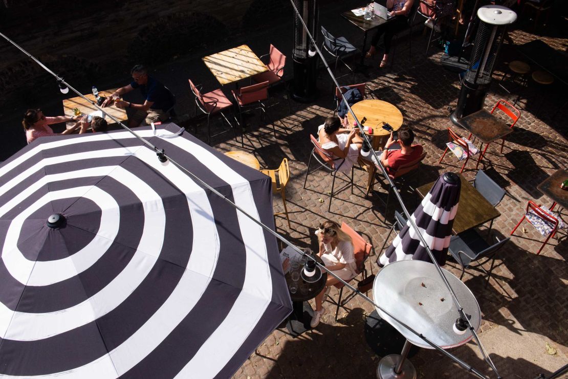 Diners on a terrace near London's Borough Market last month. Brits have been allowed to go for a meal outdoors or indoors with up to six people or as two households since mid-May.