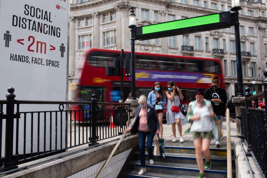 People walk into Oxford Circus Underground Station. Using public transportation again is cited as one of the activities Brits are most anxious about, according to multiple pandemic surveys.