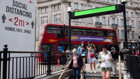 People walk into Oxford Circus Underground Station. Using public transportation again is cited as one of the activities Brits are most anxious about, according to multiple pandemic surveys.