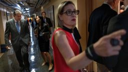 Sens. Kyrsten Sinema (D-AZ) and Joe Manchin (D-WV, left) arrive for a bipartisan meeting on infrastructure.