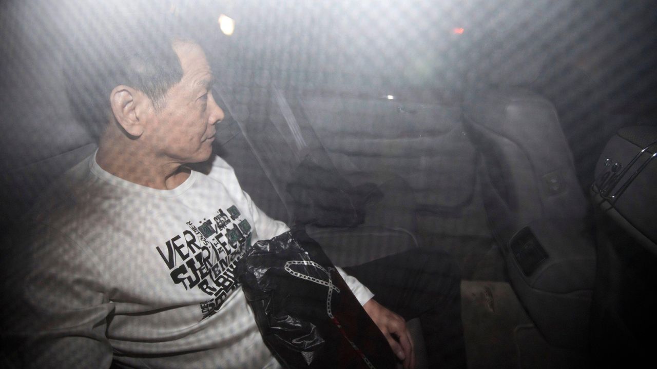 Former triad leader Wan Kuok-koi leaves in a car after his release from prison in Macao in 2012.