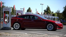 A Tesla car sits parked at a Tesla Supercharger on September 23, 2020 in Petaluma, California. California Gov. 