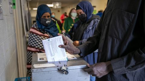 LANSING, MICHIGAN - NOVEMBER 02: Somali Americans cast their early votes at the Lansing City Clerk's office on November 02, 2020 in Lansing, Michigan. In 2016 U.S. President Donald Trump narrowly won Michigan, which is now a main battleground state. (Photo by John Moore/Getty Images)