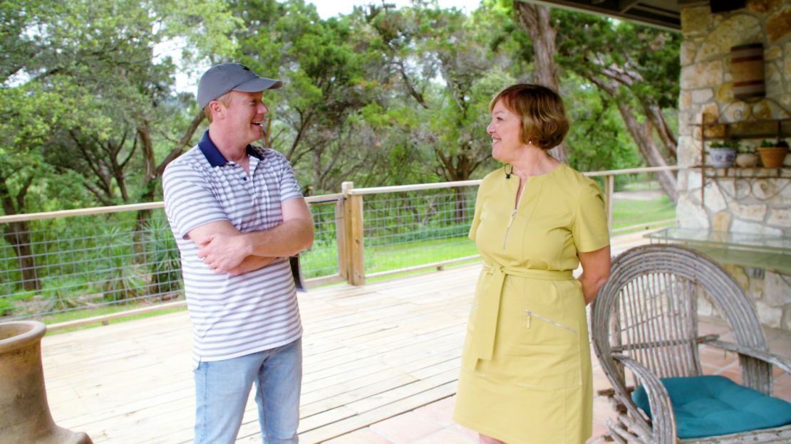 Clayton Bullock talks with Cindy Goldrick at an open house in West Lake Hills, Texas, a suburb of Austin.