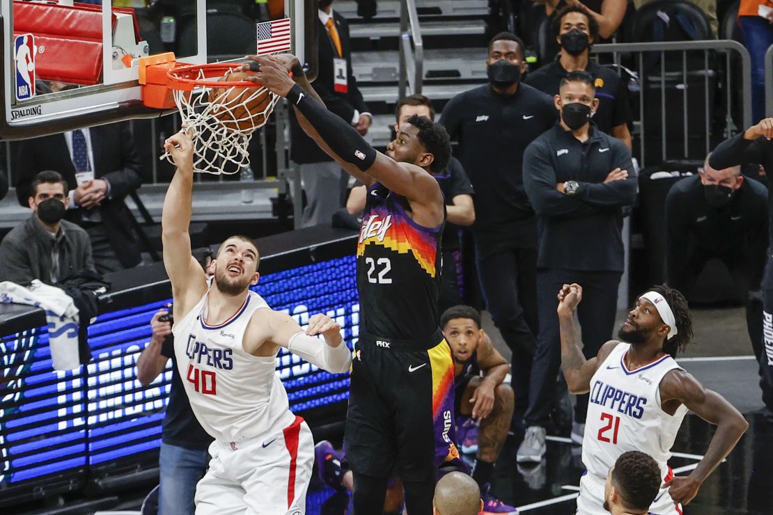 Deandre Ayton tips the ball in over Ivica Zubac in the closing moments of Game Two.