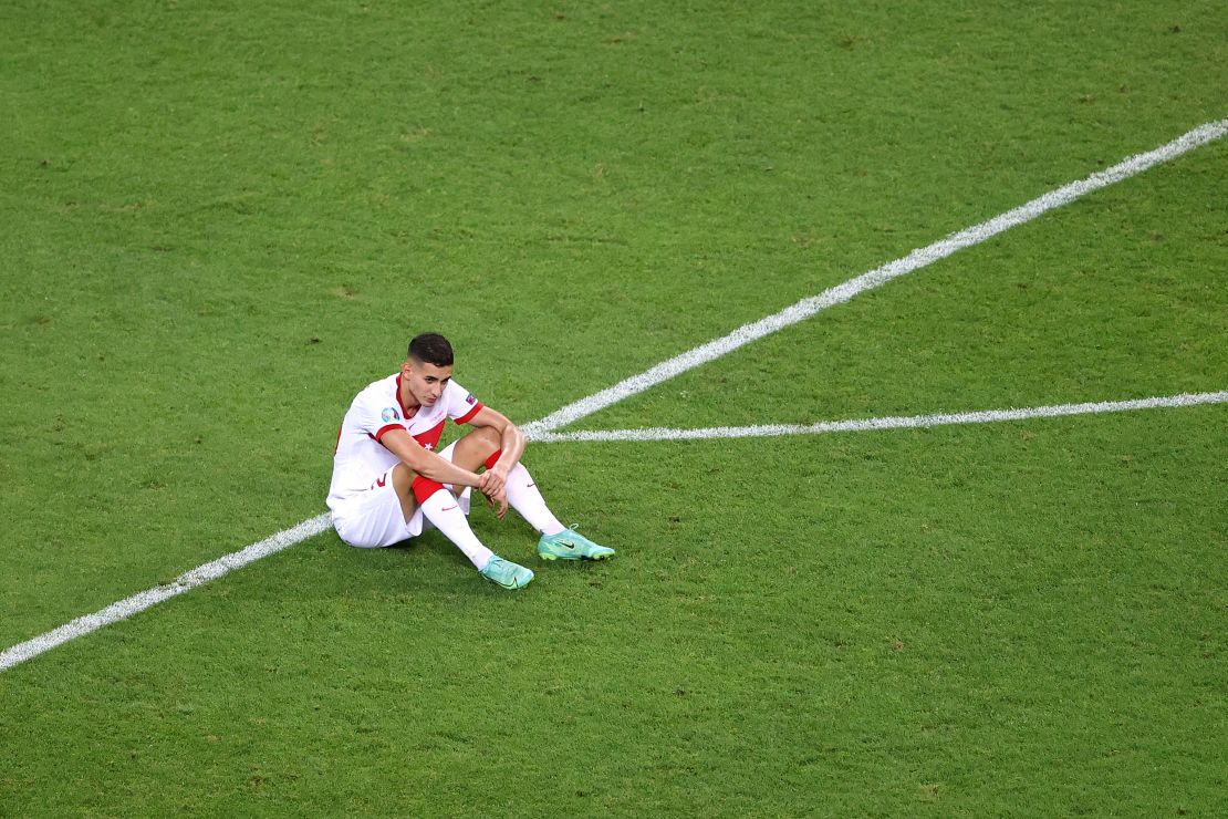 Mert Muldur looks dejected following the defeat to Switzerland.