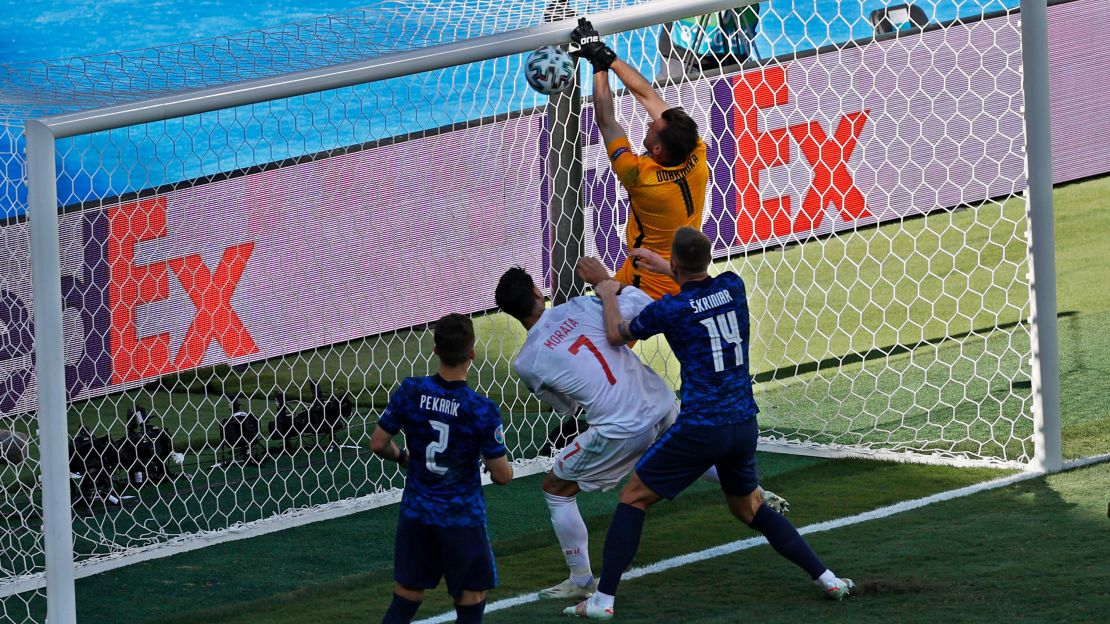 Slovakia's goalkeeper Dubravka scores an own-goal while attempting to clear the ball.