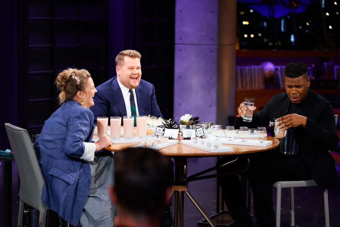 Drew Barrymore and John Boyega play "Spill Your Guts or Fill Your Guts" with James Corden during "The Late Late Show with James Corden" in 2018. 